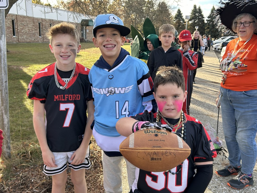 kids dressed as football and baseball player