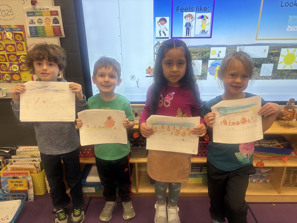 kindergarteners with their first books