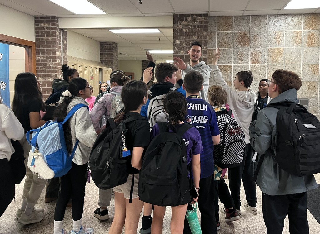 Mr. Zurek receiving high, high fives from our students at the end of his last day at WLMS.