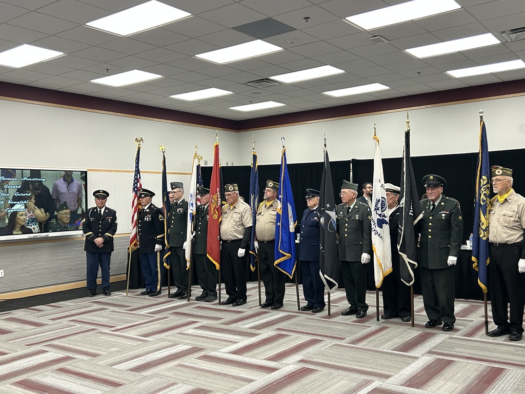 Colorguard with flags at school board meeting 
