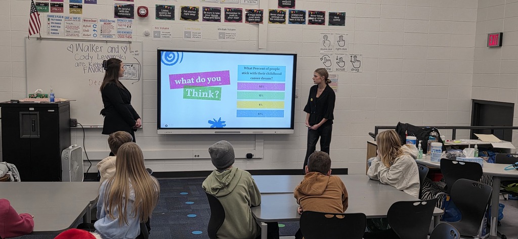 DECA students visit elementary classroom