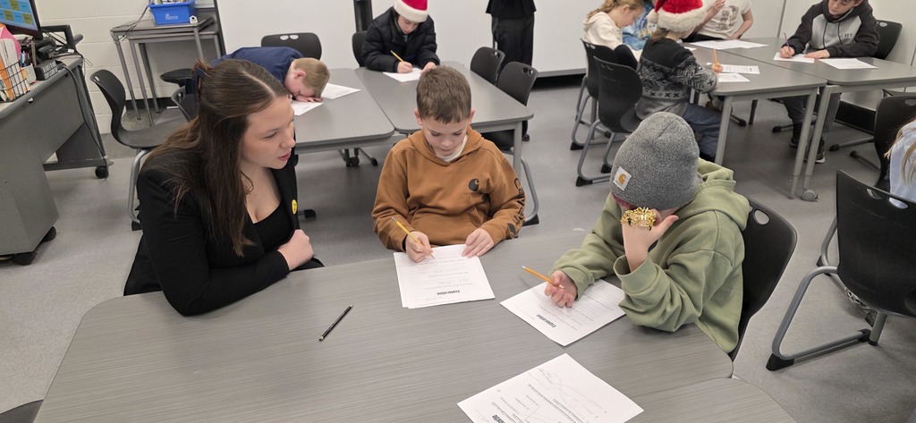 DECA students visit elementary classroom