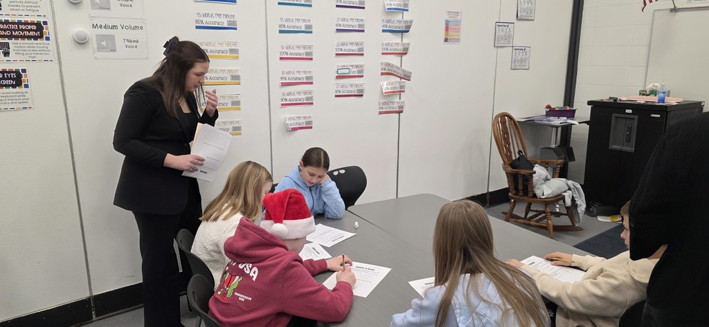 DECA students visit elementary classroom