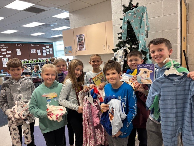 Our fourth graders donated books and pajamas for families in need in our community.