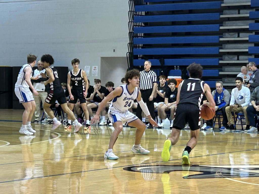 Lakeland Boys Basketball guarding a Milford Basketball player