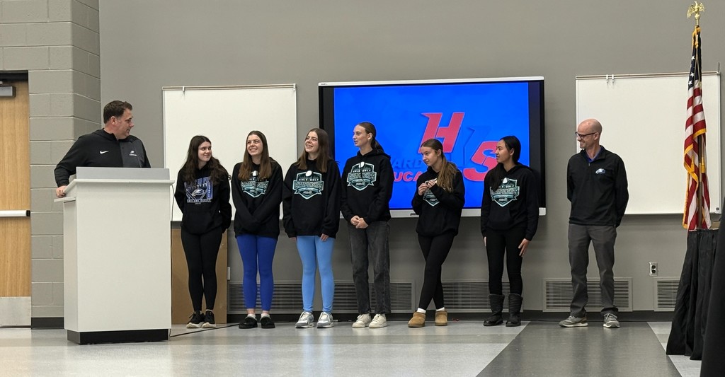Picture of several members from the Lakeland Girls Golf Team at school board meeting