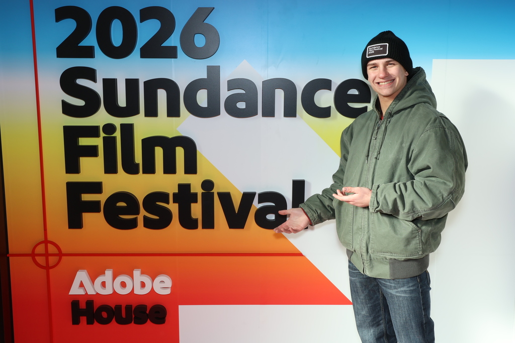 Image of HVS student standing in front of 2026 Sundance film festival billboard