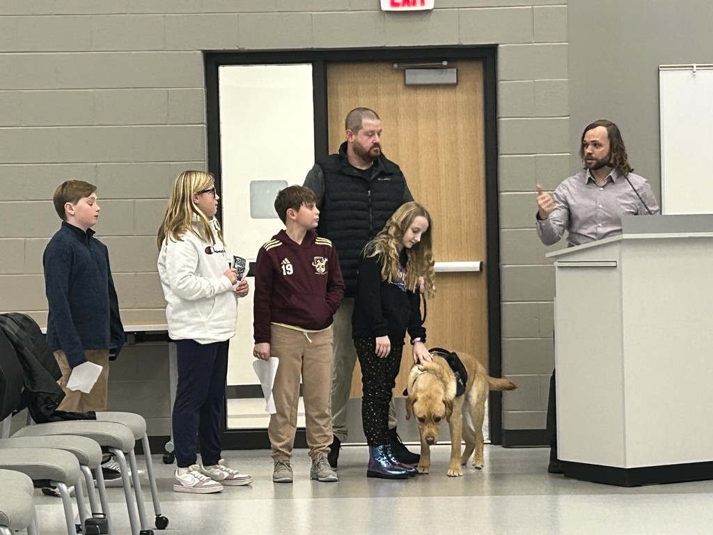 Spring Mills elementary students presenting Teddy to the board 