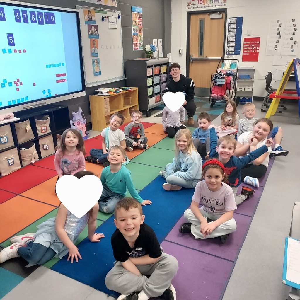 LHS football players reading to lakewood students