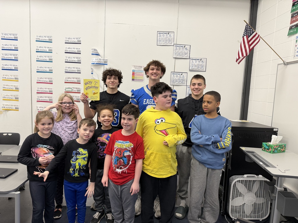 LHS football players reading to lakewood students