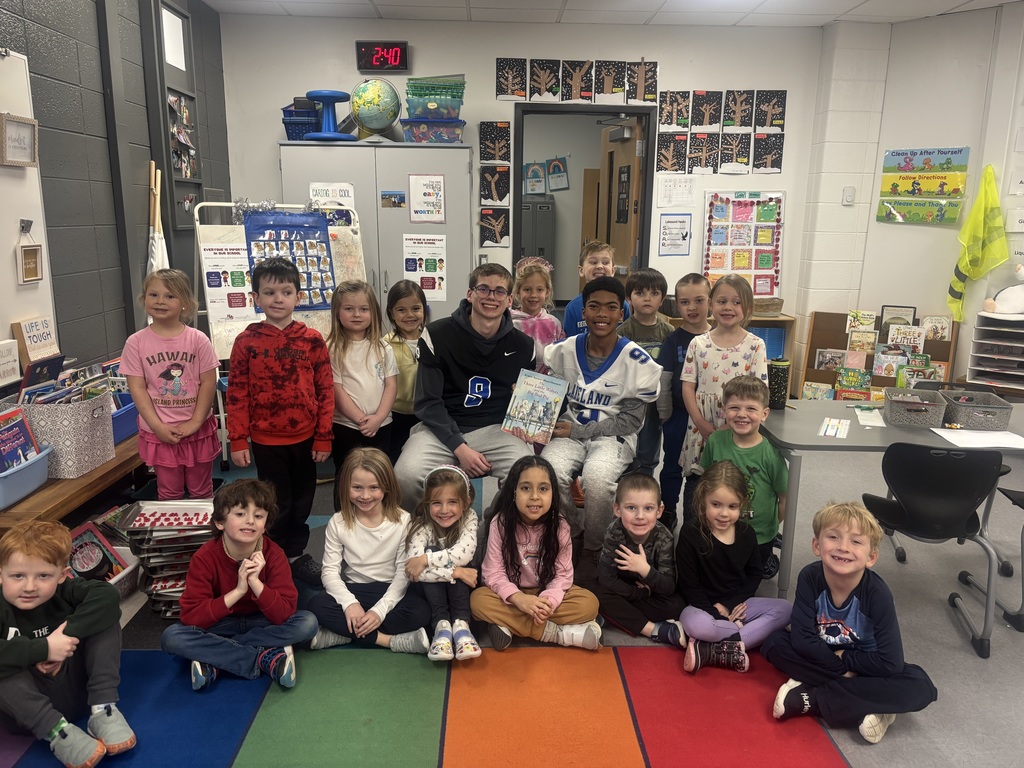 LHS football players reading to lakewood students