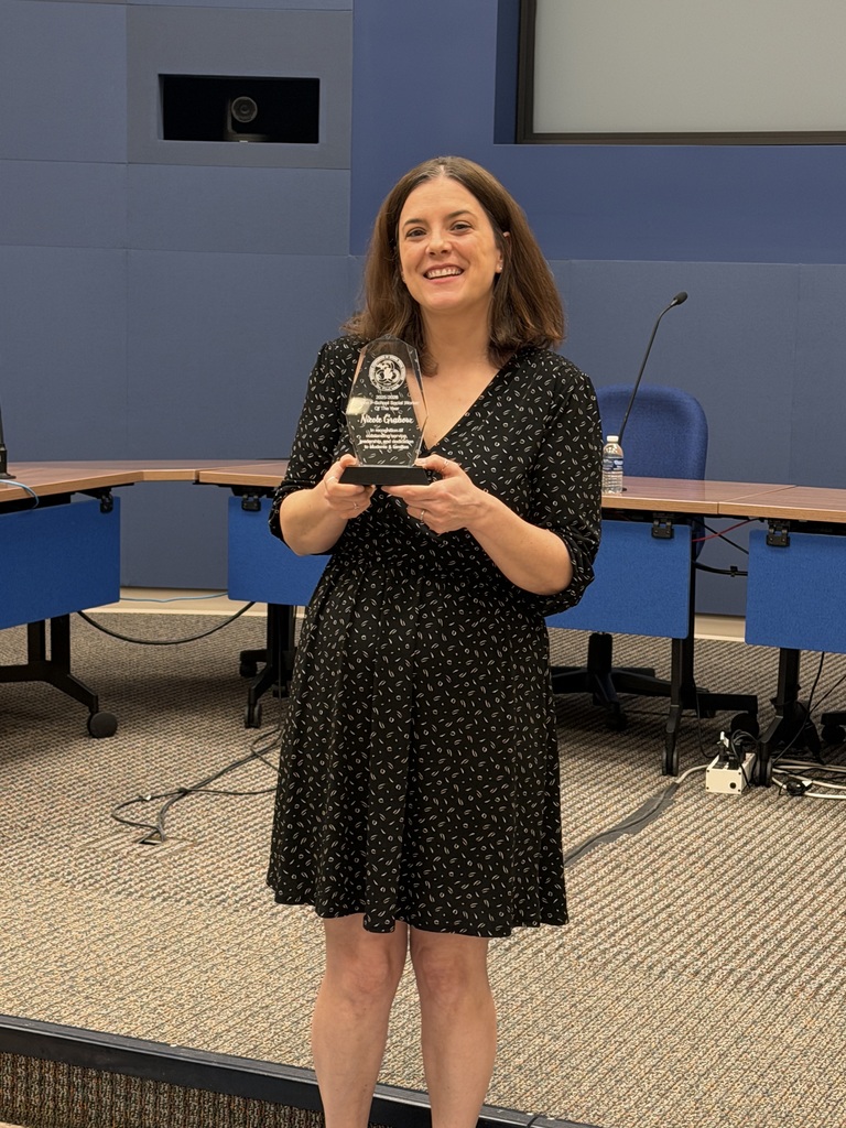 Photo of Nicole Grabow for Oakland County Social Worker of the Year holding her trophy