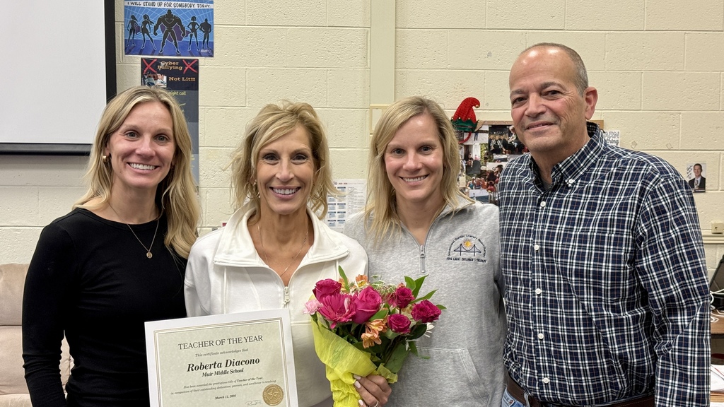 HVS Middle School Teacher of the Year, Roberta Diacono with her family in her classroom
