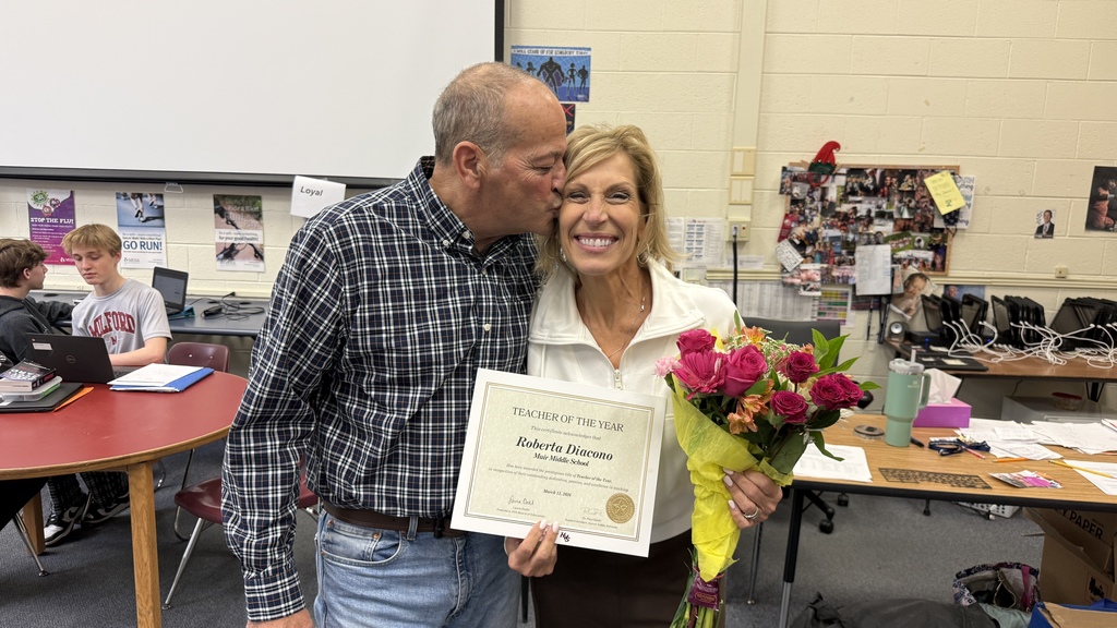HVS Middle School Teacher of the Year, Roberta Diacono with her family in her classroom