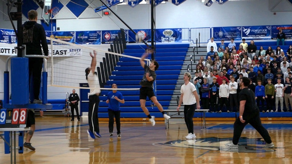 Images of LHS staff playing LHS students in volleyball