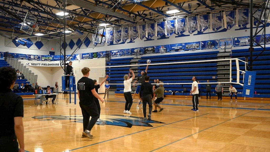 Images of LHS staff playing LHS students in volleyball