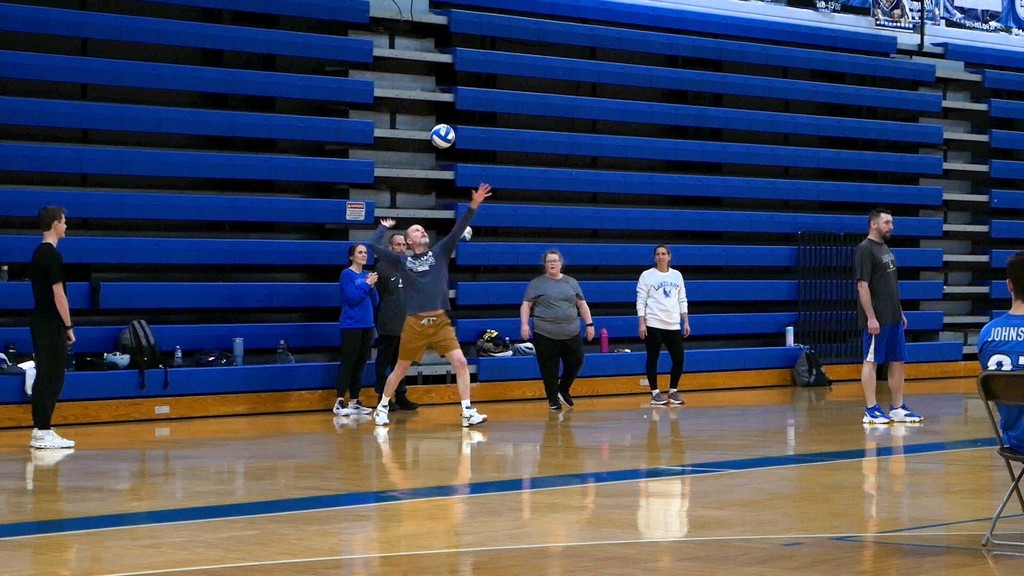 Images of LHS staff playing LHS students in volleyball