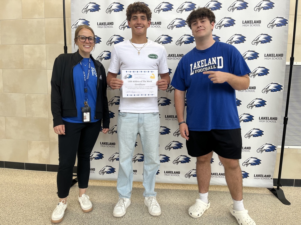 Haney, Johns, and Croll congratulating Johns for Athlete of the Week