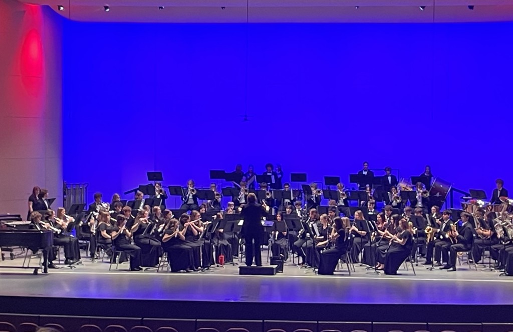Photo of school band playing on stage 