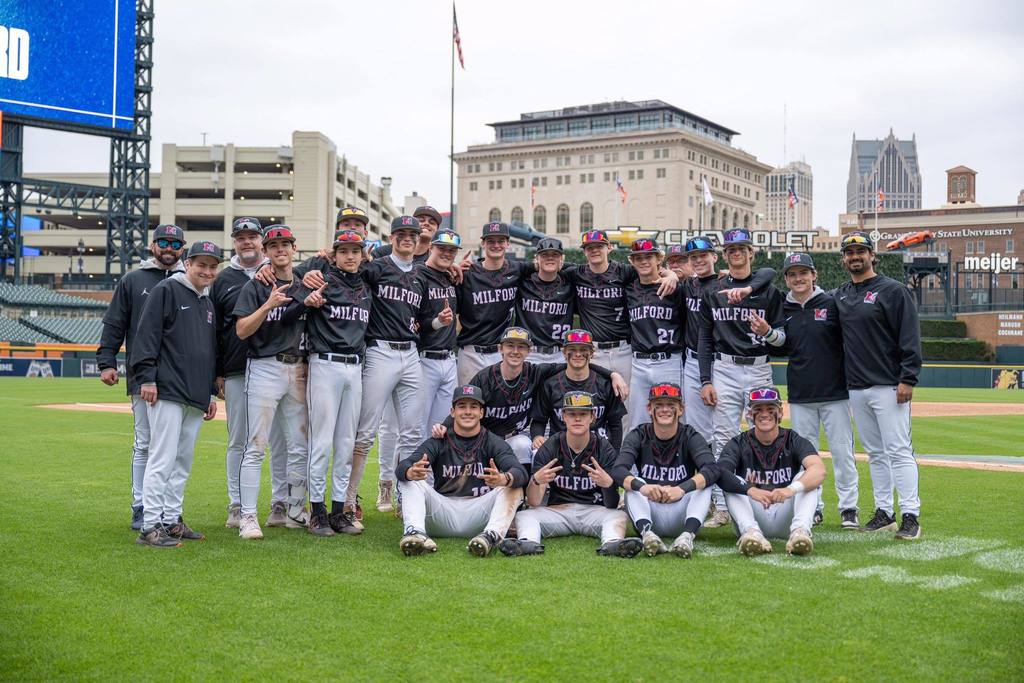Team photo of MHS baseball team at Comerica Park after game