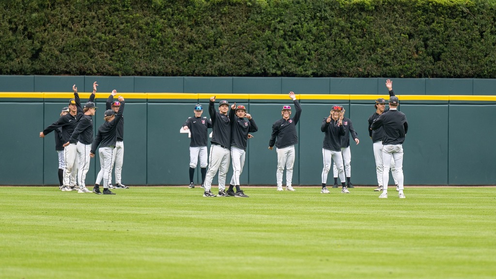 mhs players stretchign and warming up at comerica park