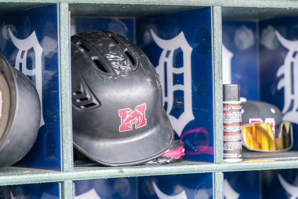 Photo of MHS baseball helmet next to Tigers english D