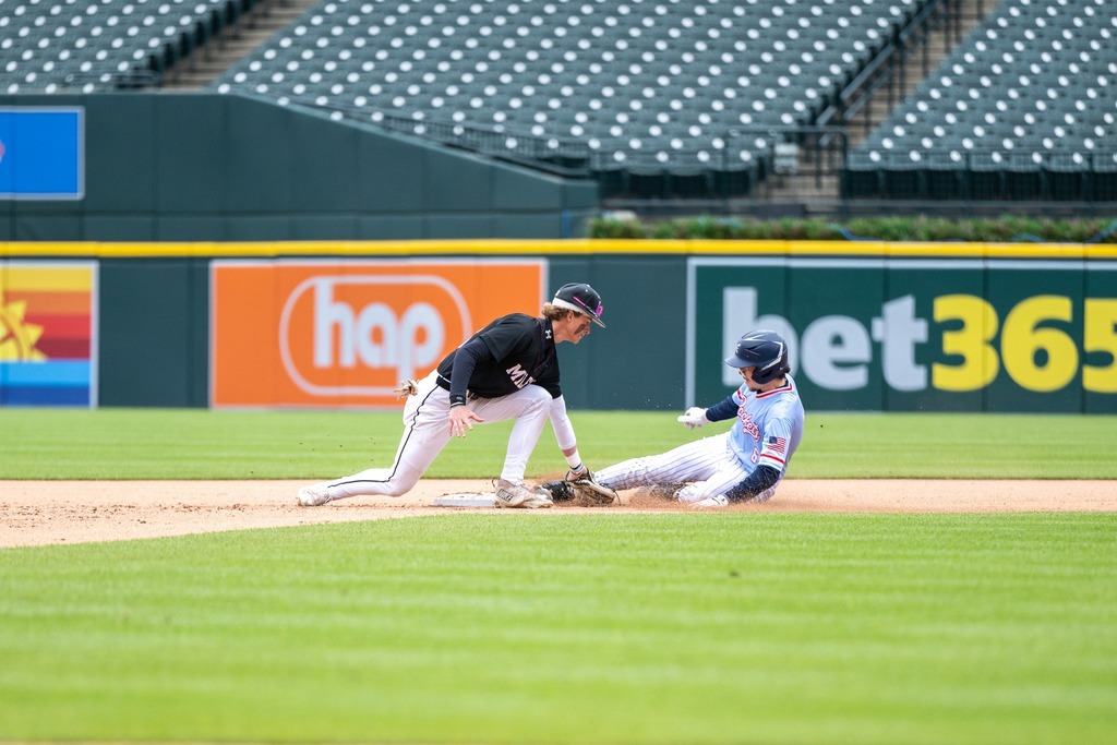 MHS baseball player tagging opponent on throw to second base at Comerica Park during game 