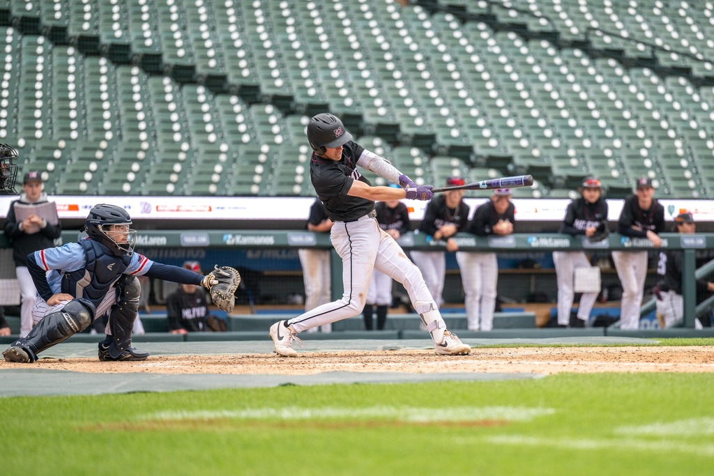MHS baseball player swinging bat at Comerica Park during game 