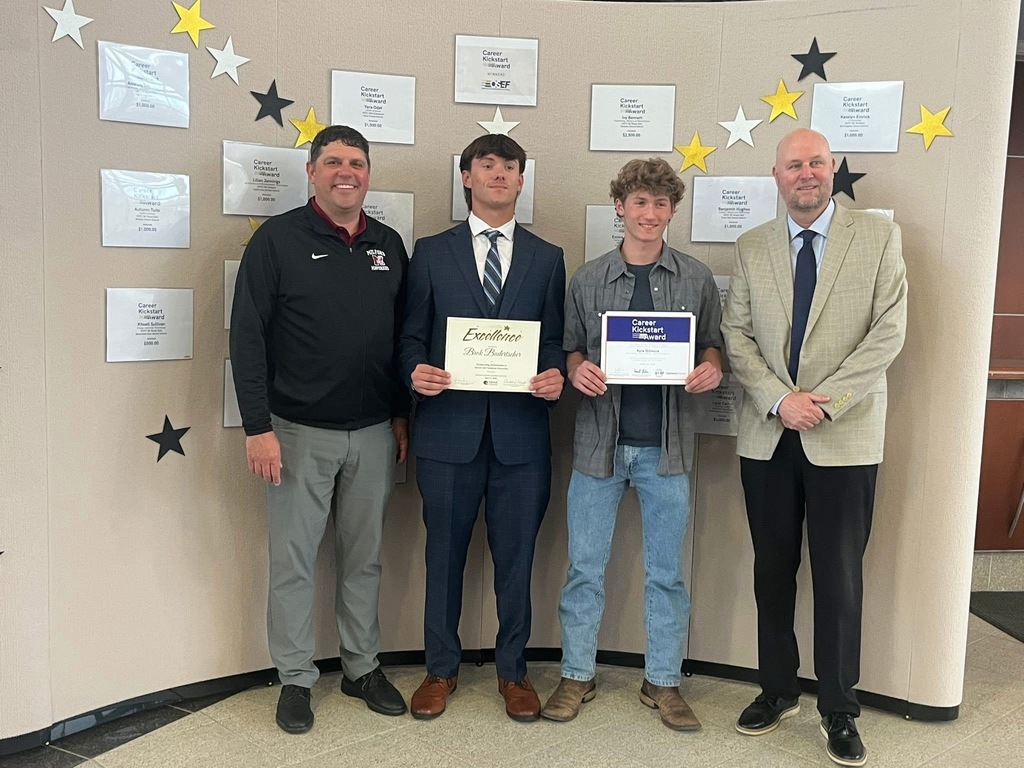 Photo of Brok Badertscher holding CTE excellence certificate & Kyle holding an award flanked by two educators