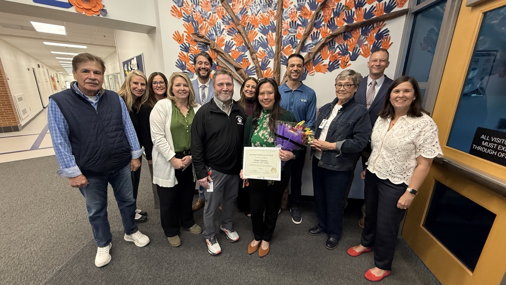 Group photo of HVS support person of the year Gina Ciancio and other HVS staff 