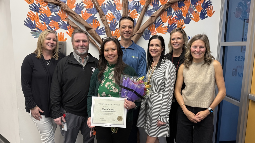 Group photo of HVS support person of the year Gina Ciancio and other HVS staff 