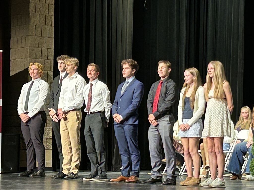 photo of students on stage being honored for academics