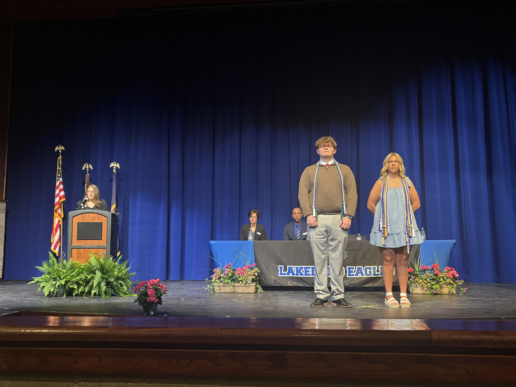 photo of students on stage being honored for academics