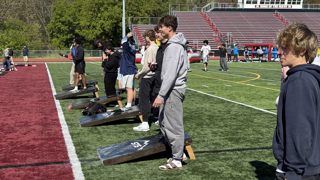 Photo of students playing a game on football field at MHS