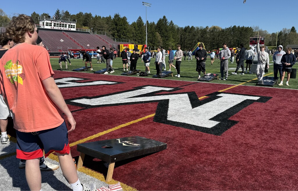 Photo of students playing a game on football field at MHS