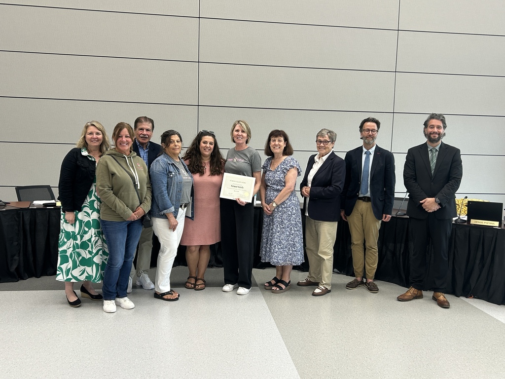 Grant Girls women holding certificate and posing with HVS board members