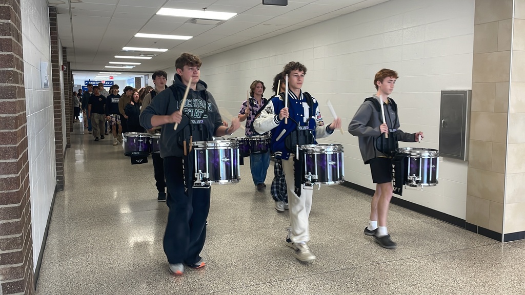 Marching band leading Lakeland seniors out to their clapout