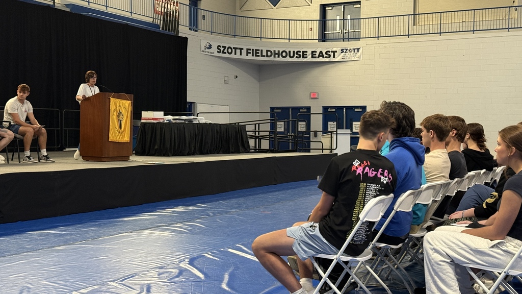SHOT OF  STUDENTS SITTING DURING A GRADUATION REHEARSAL