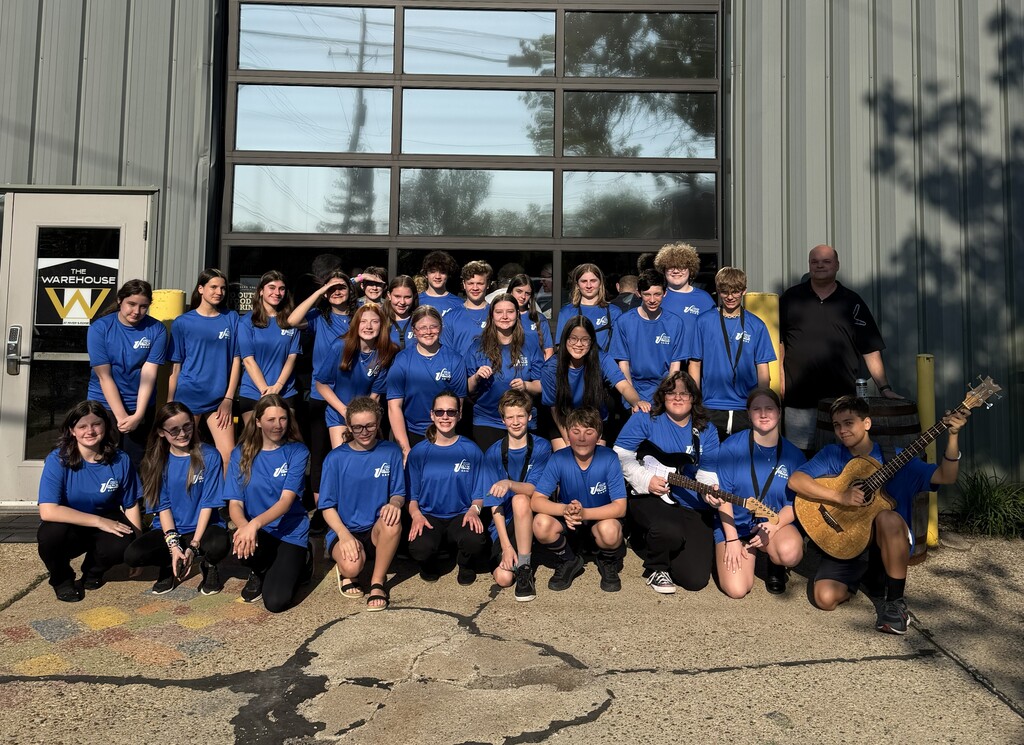 Picture of our Jazz Band in front of the Warehouse on performance night