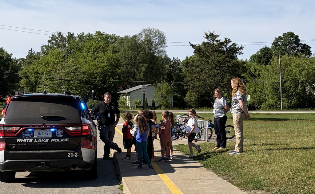 Junior Kindergarteners receive a safety lesson from Officer Welling