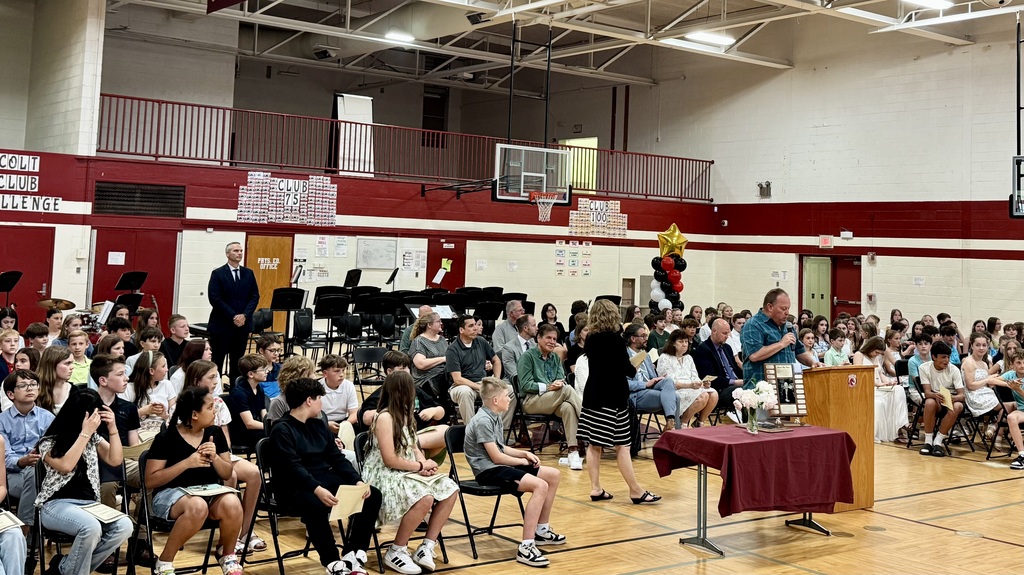 Crowded gym with students & staff assembling to hand out honors awards