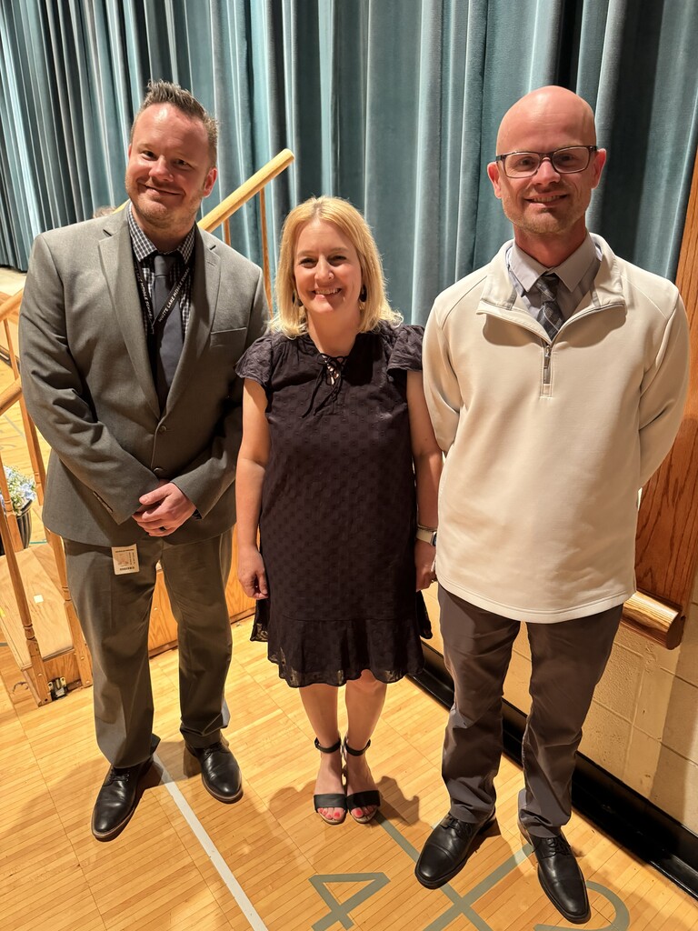 Three educators standing and posing for a photo 