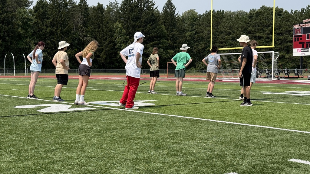 photo of marching band members in a circle