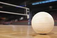 Picture of a volleyball on the floor of a volleyball court
