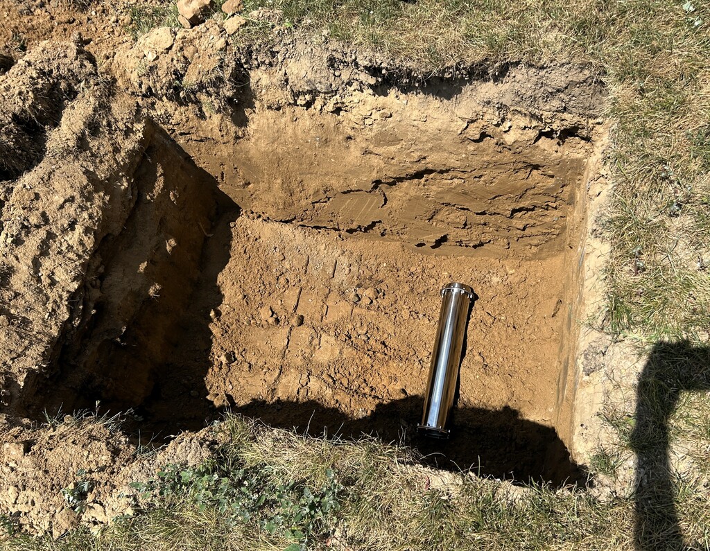 Photo of time capsule placed in a deep hole