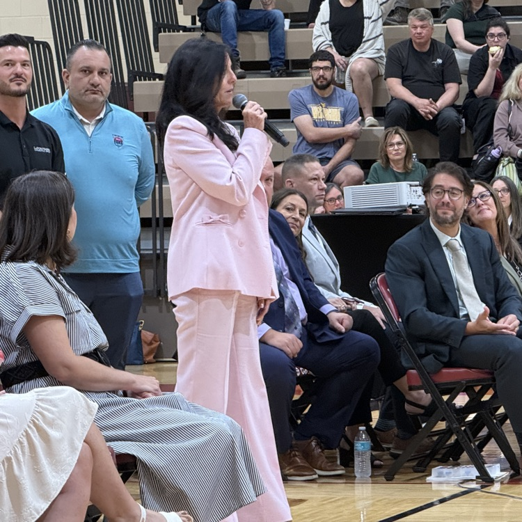 opening day crowd and teachers in gym.