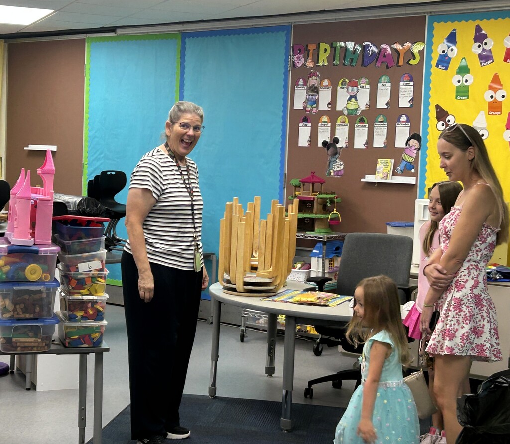 Students and parents tour a school building