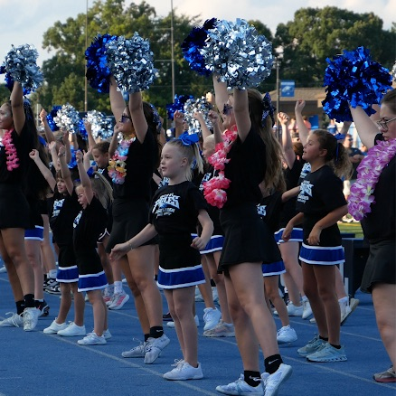 cheerleaders on the sideline during a football game