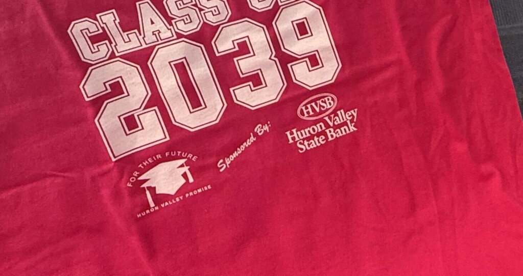 Closeup of hot pink shirt that reads "class of 2039"