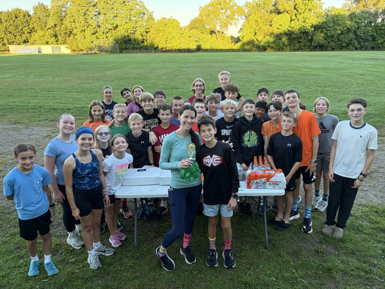 Cross Country coaches and runners enjoying donuts